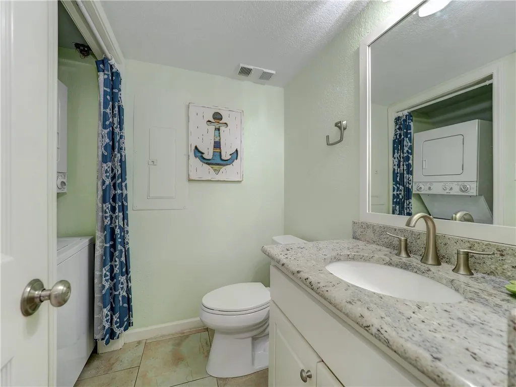 Kitchen with quartz countertops and dry bar